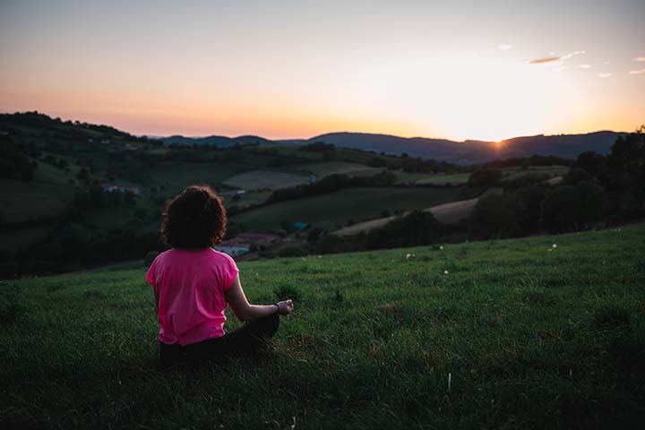 woman Meditating on Grass
